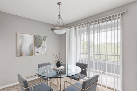 a dining room with a glass table and chairs at Veranda at Centerfield, Houston, TX, 77070